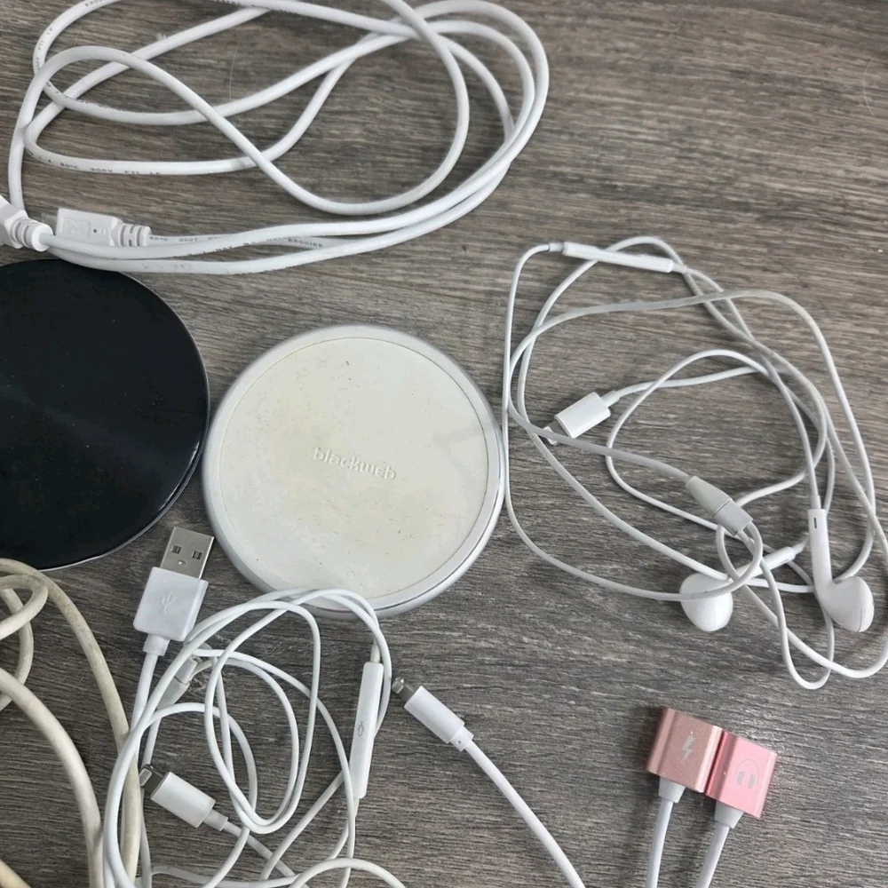 Assorted White and Black Mobile Charging Cables with Pink Accents